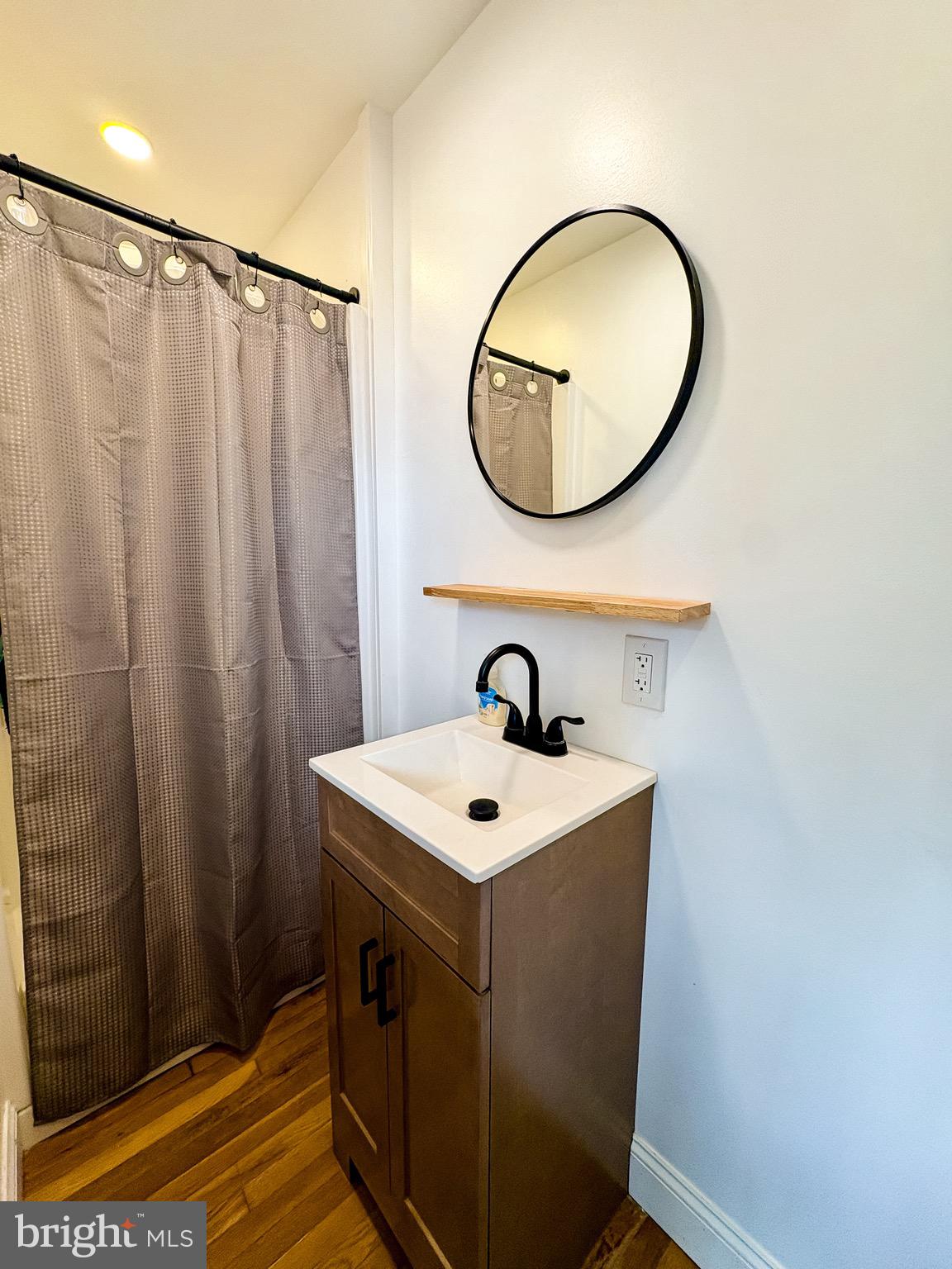 1947 Sand Hill Road Hershey, PA 17033 - Photo 6 of 16 a bathroom with a sink a mirror and a vanity