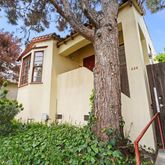 a view of a house with a small yard