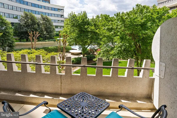 a view of swimming pool with an outdoor seating