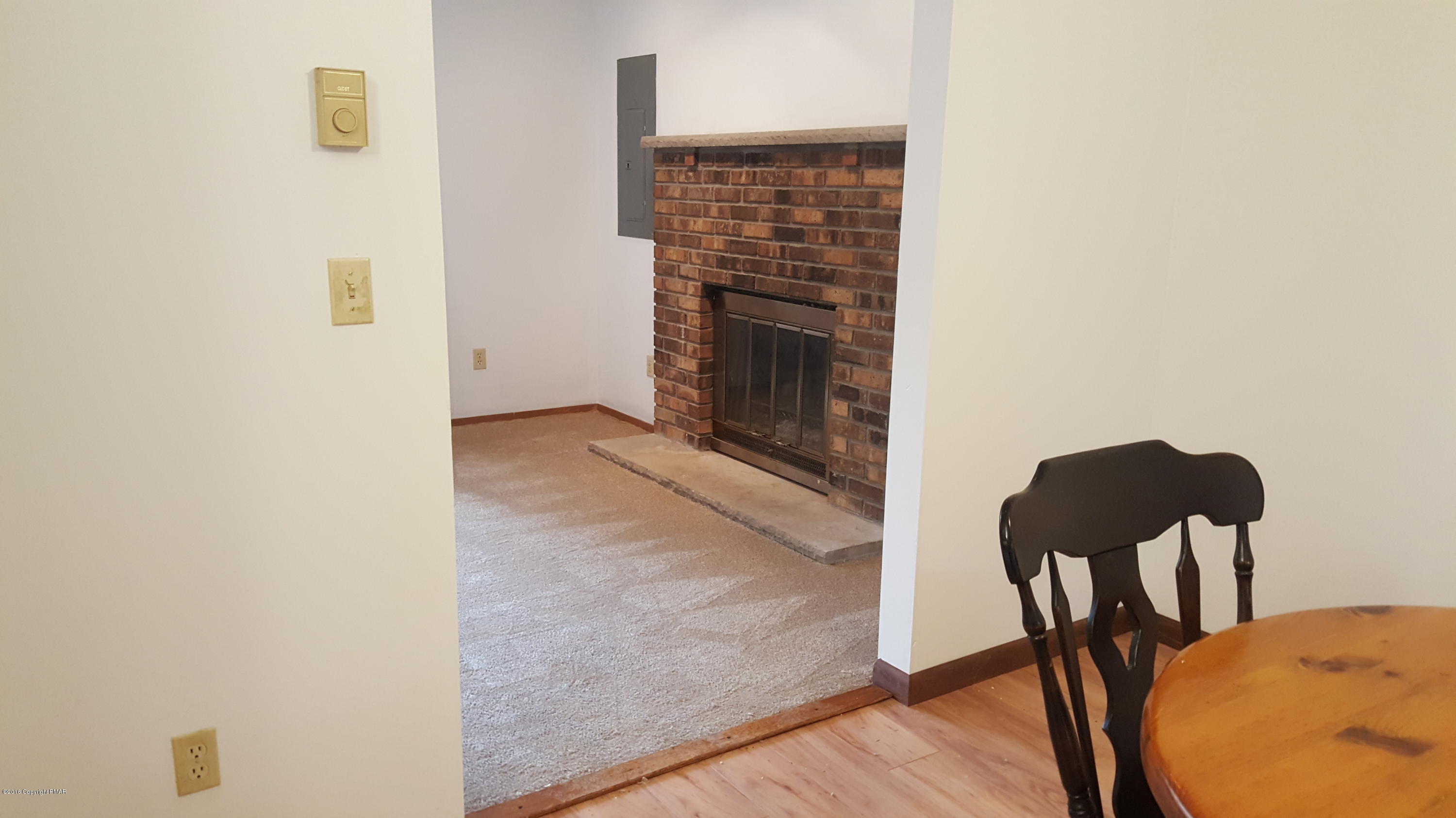 114 Weasel Road Dingmans Ferry, PA 18328 - Photo 12 of 51 a view of a livingroom with furniture and a couch