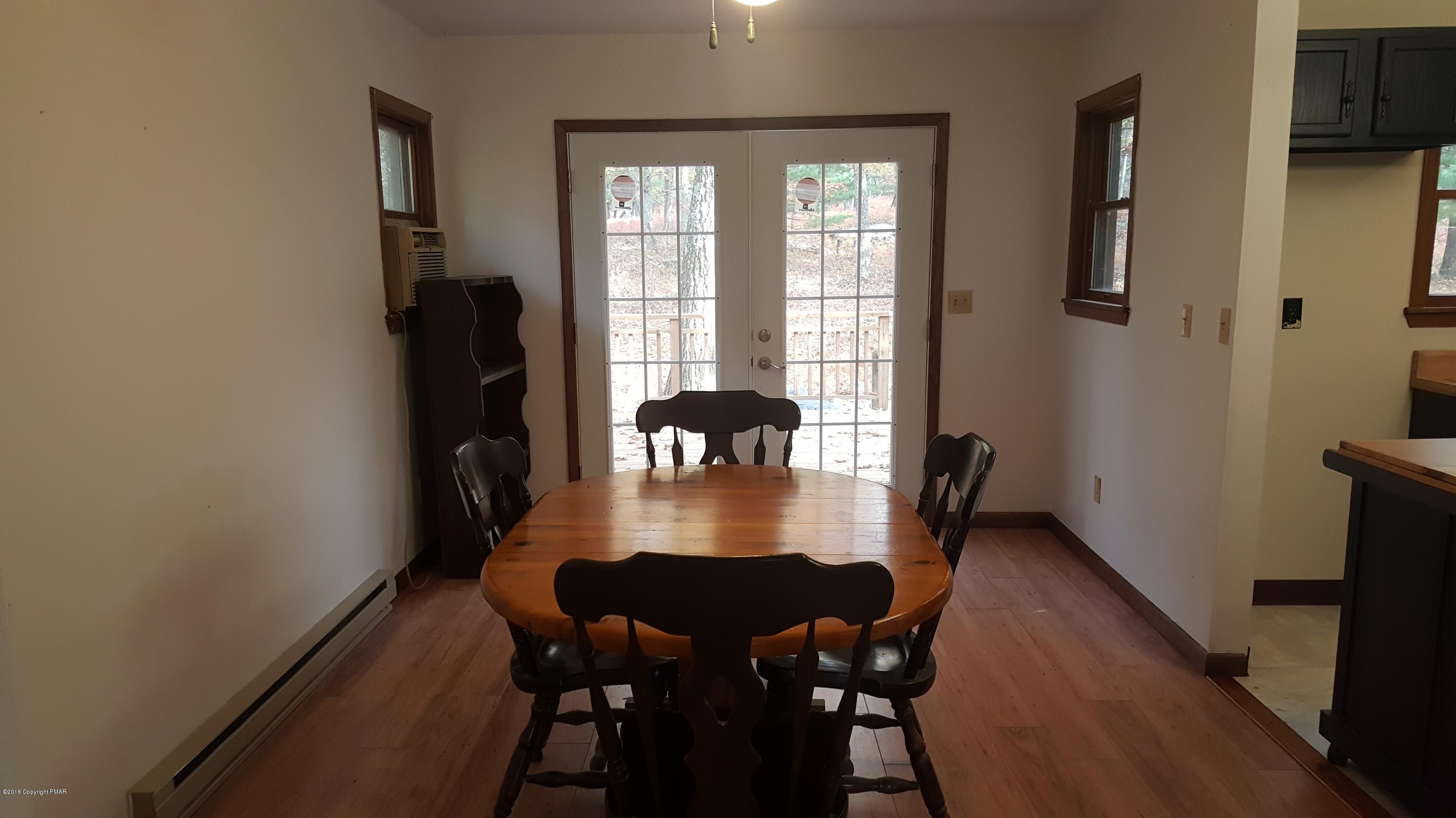 114 Weasel Road Dingmans Ferry, PA 18328 - Photo 13 of 51 a view of a dining room with furniture and window