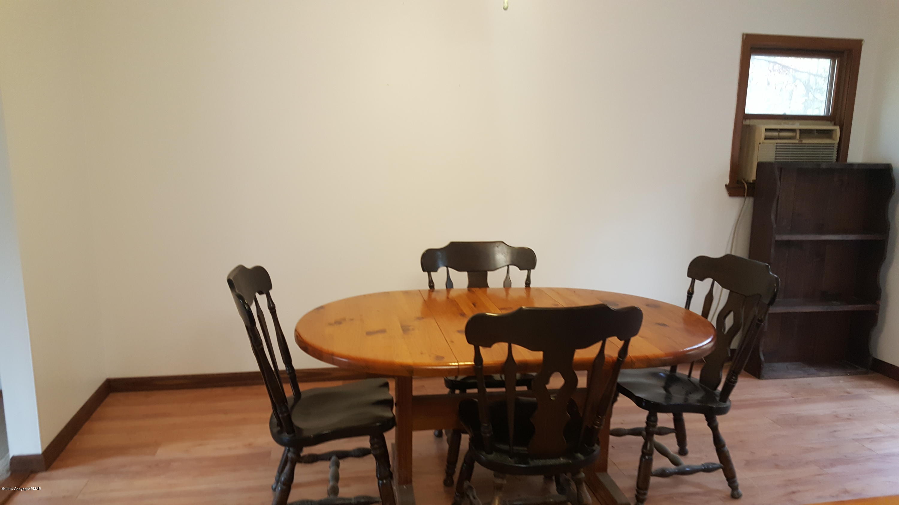 114 Weasel Road Dingmans Ferry, PA 18328 - Photo 15 of 51 a dining room with furniture and window