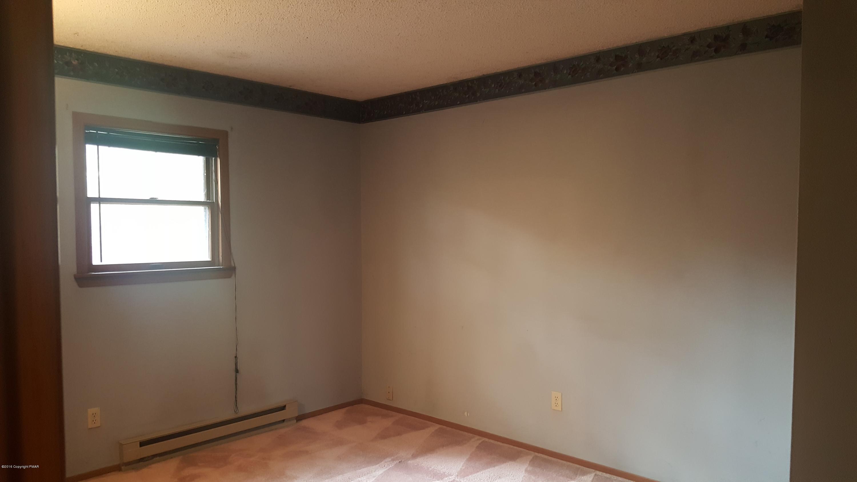 114 Weasel Road Dingmans Ferry, PA 18328 - Photo 27 of 51 a view of a room that has a window