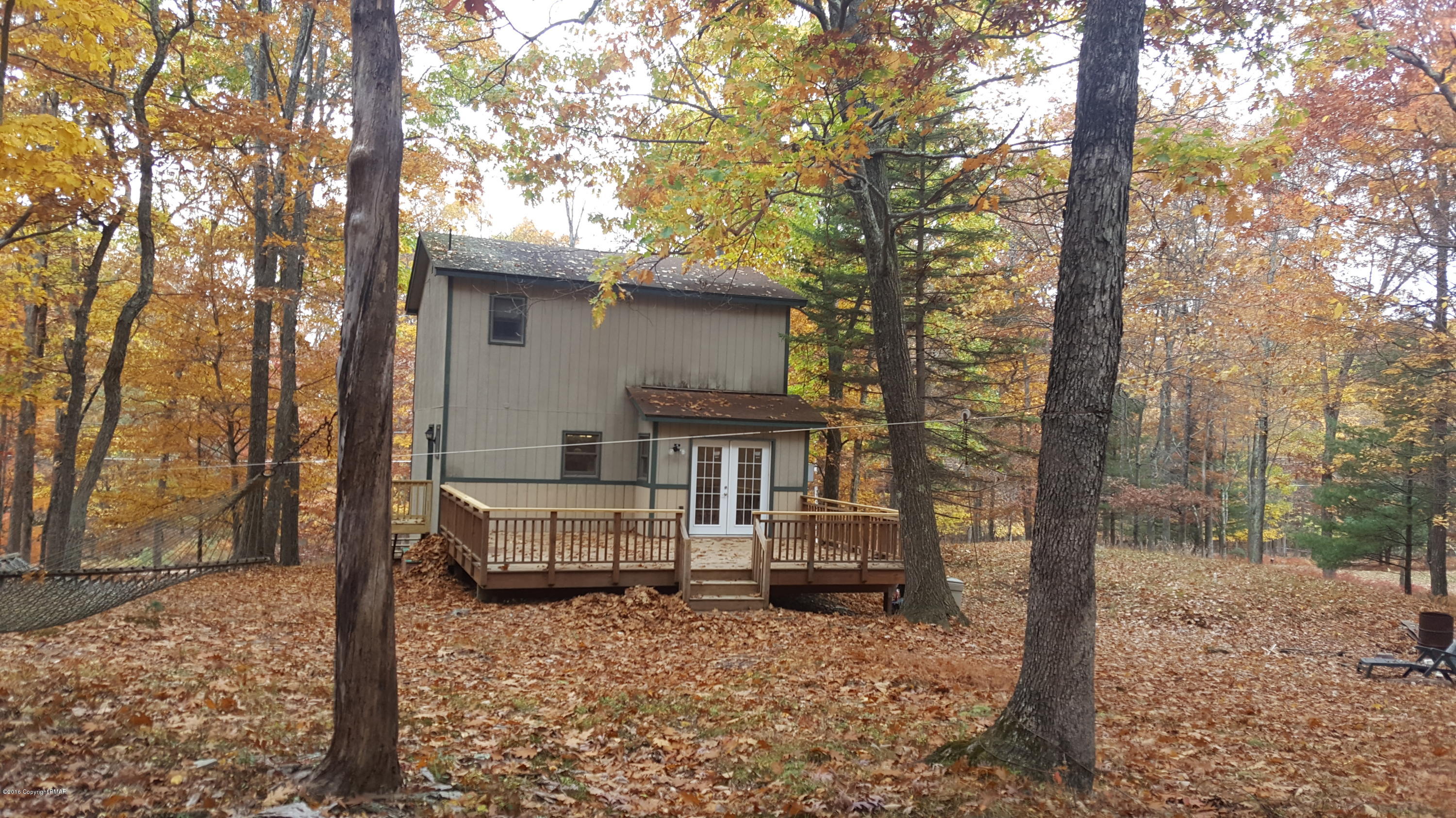 114 Weasel Road Dingmans Ferry, PA 18328 - Photo 39 of 51 a view of a house with a yard