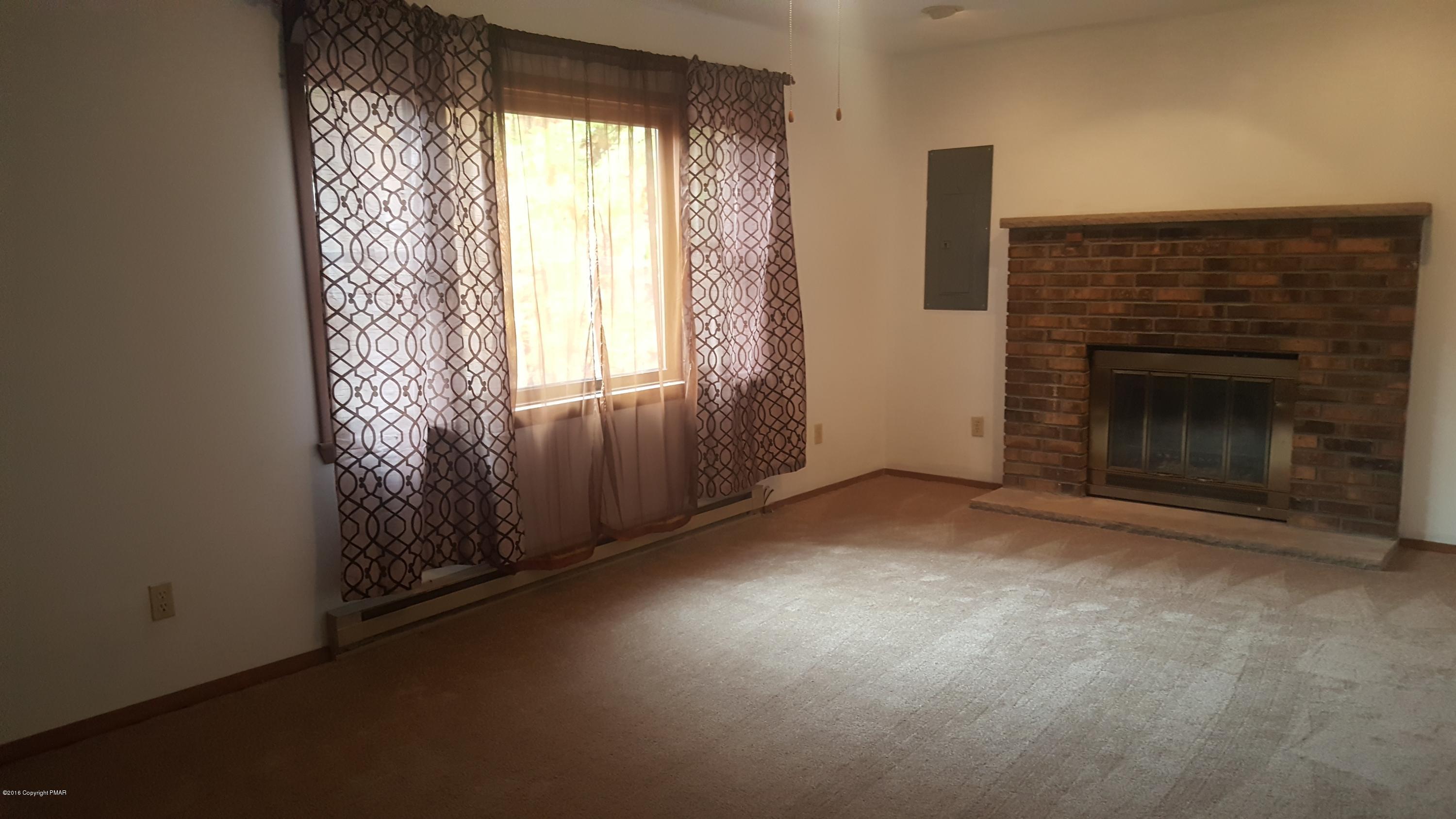 114 Weasel Road Dingmans Ferry, PA 18328 - Photo 5 of 51 an empty room with windows