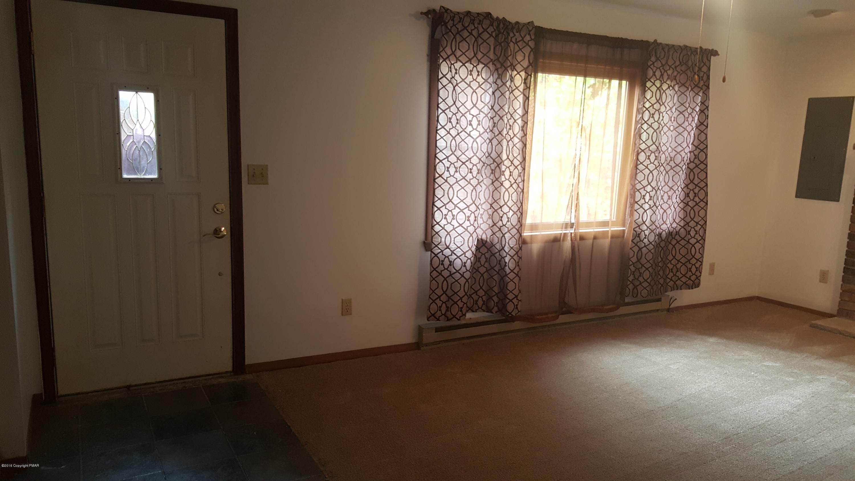 114 Weasel Road Dingmans Ferry, PA 18328 - Photo 8 of 51 an empty room with windows