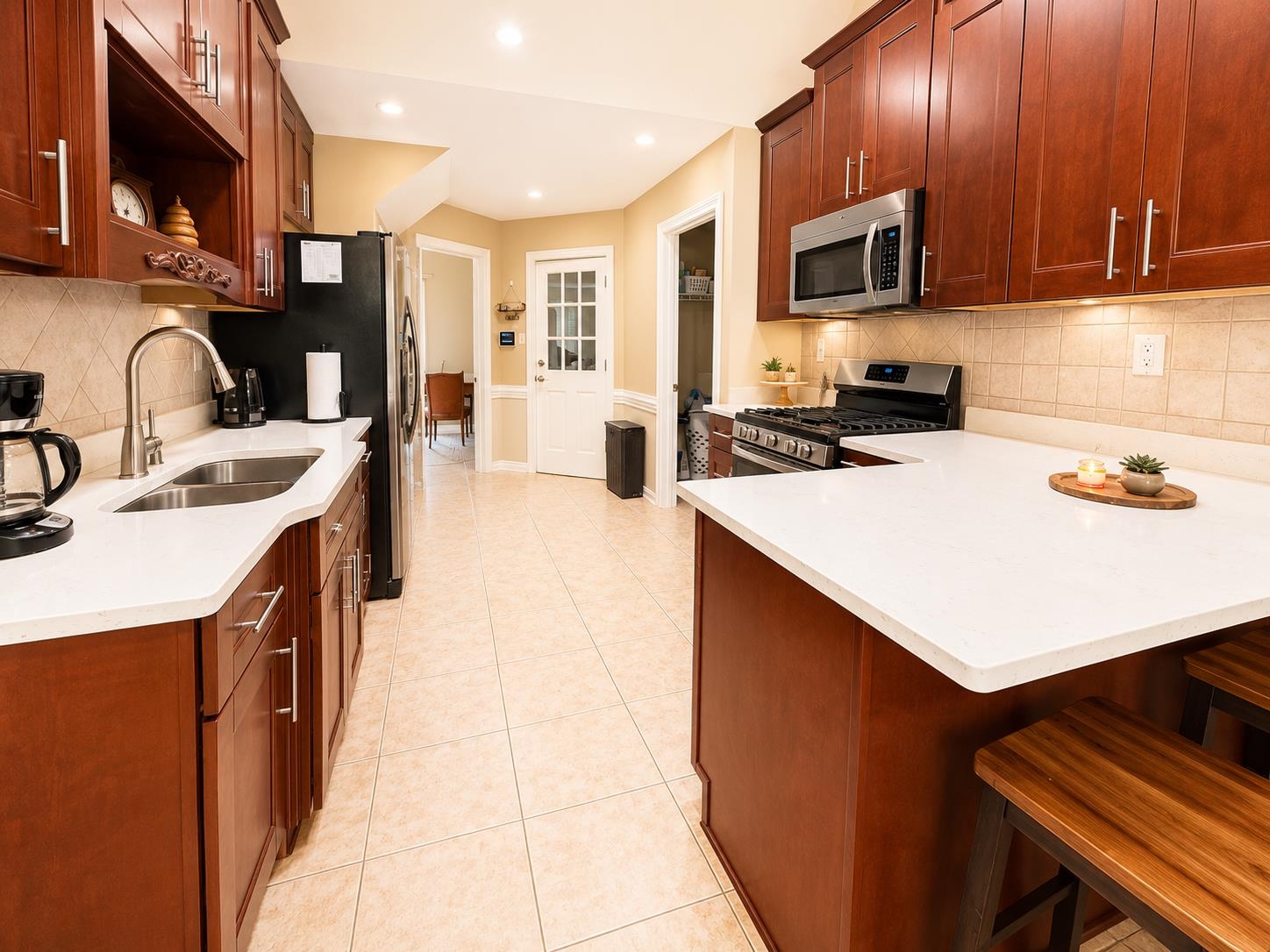 326 South Sanga Road Cordova, TN 38018 - Photo 12 of 32 Kitchen featuring cherry-toned cabinetry and white countertops