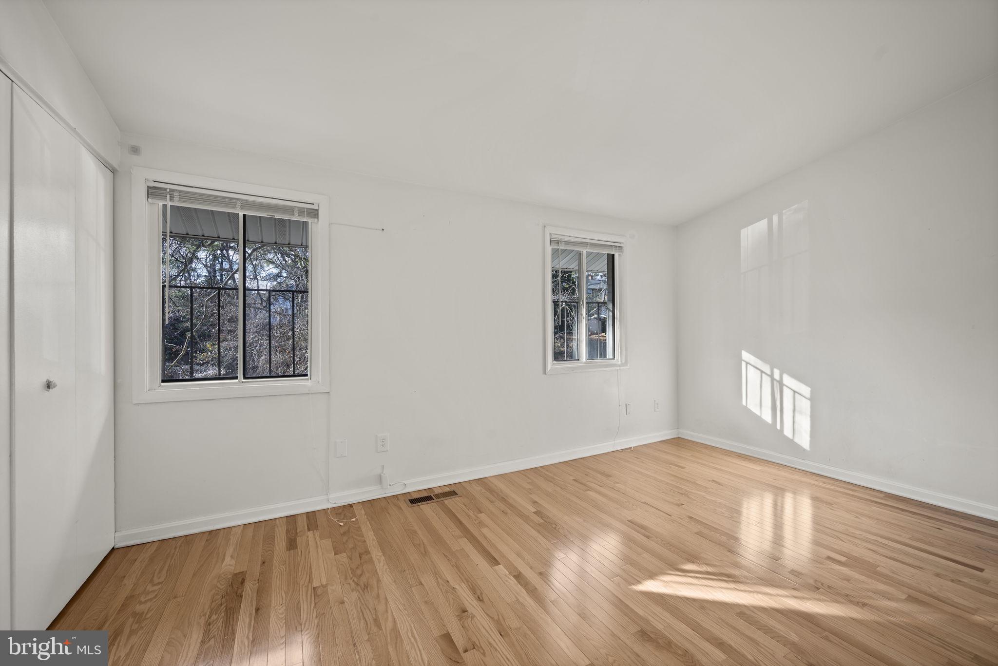 5451 Endicott Lane Columbia, MD 21044 - Photo 11 of 28 a view of empty room with wooden floor and fan