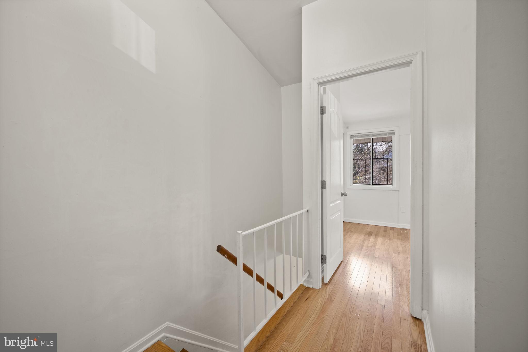 5451 Endicott Lane Columbia, MD 21044 - Photo 17 of 28 a view of a hallway with wooden floor and entryway