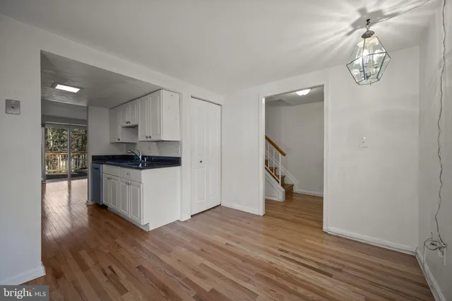a kitchen with a refrigerator and cabinets