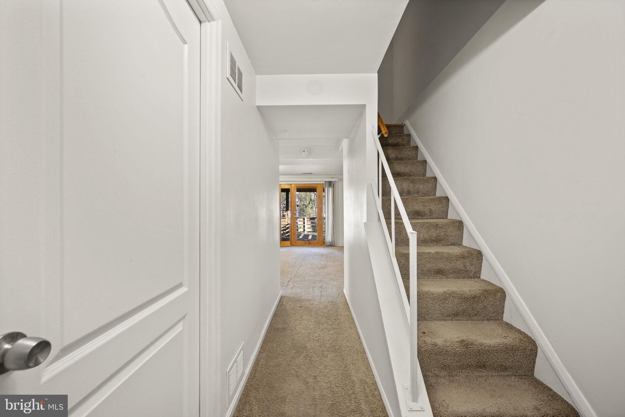 5451 Endicott Lane Columbia, MD 21044 - Photo 21 of 28 a view of a hallway with wooden floor and entryway