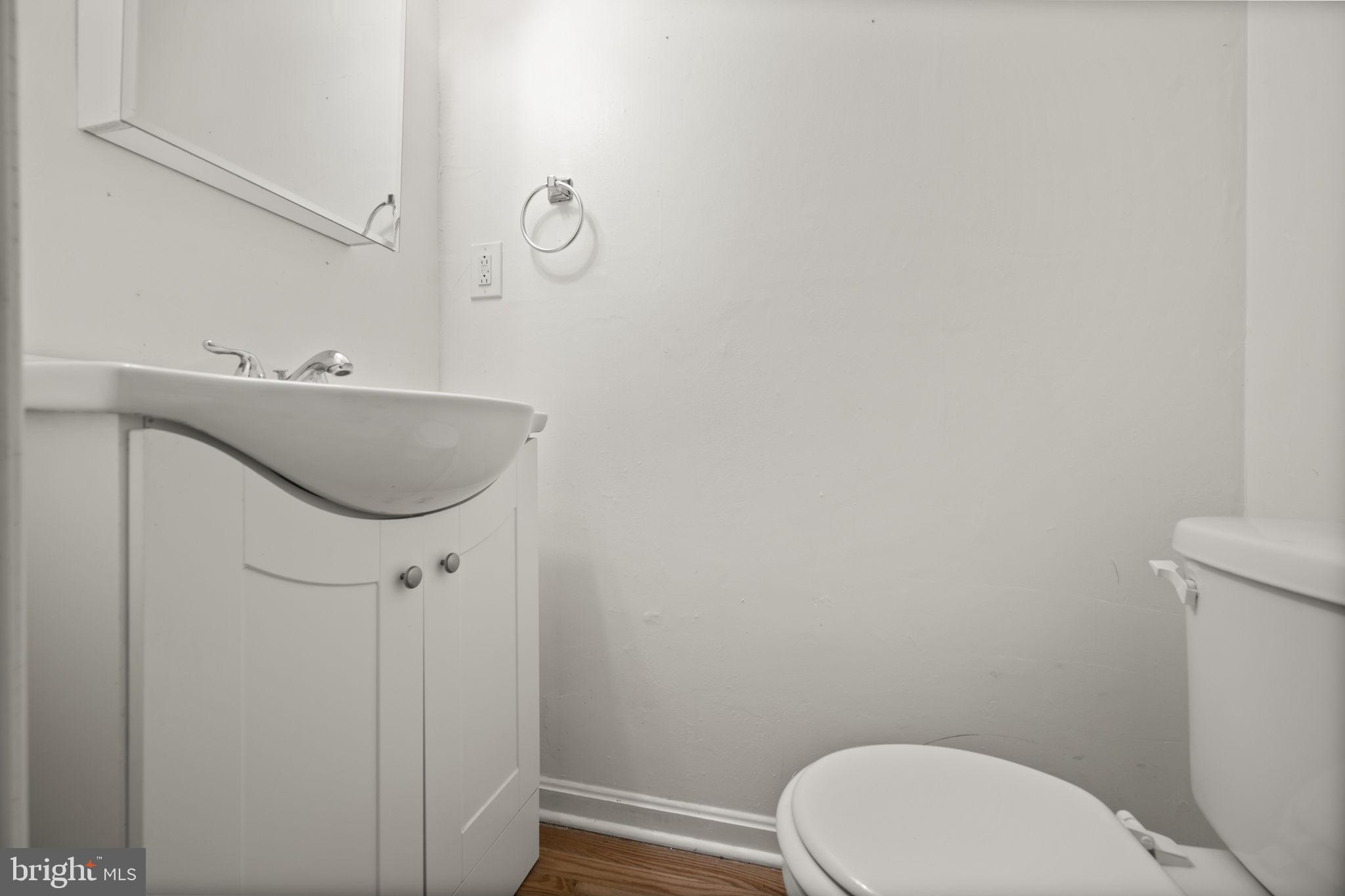 5451 Endicott Lane Columbia, MD 21044 - Photo 9 of 28 a bathroom with a toilet and a sink