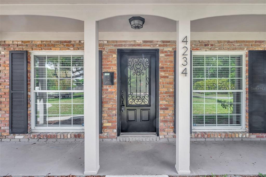4234 Kendrick Road Orlando, FL 32804 - Photo 2 of 46 a front view of a house with a large window