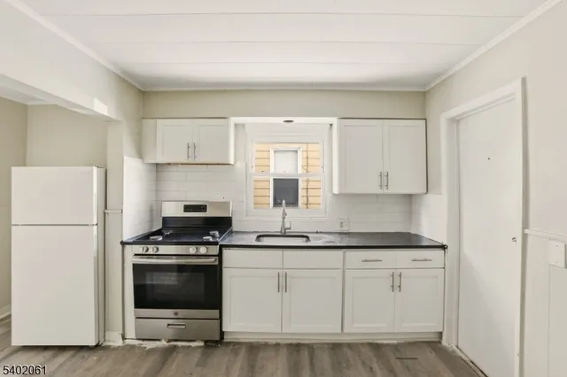 a bathroom with a toilet sink and bathtub