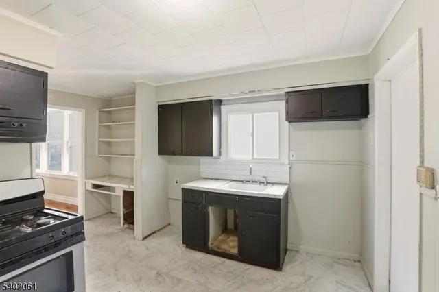 a view of a livingroom with an empty space and a window