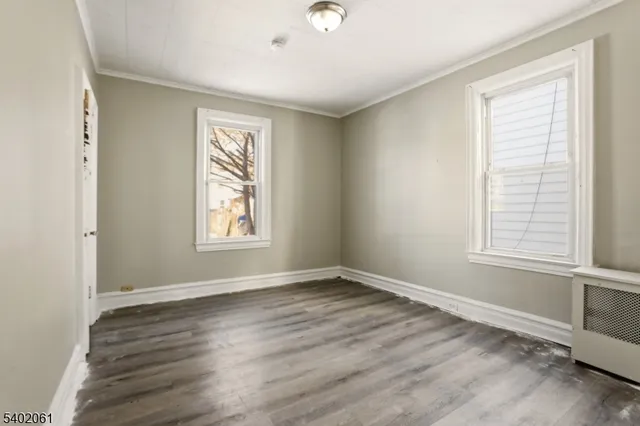 a kitchen with granite countertop a sink cabinets and stainless steel appliances
