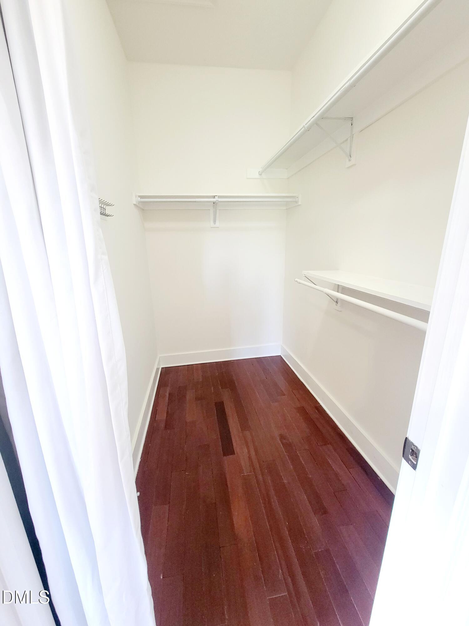 707 South East Street Raleigh, NC 27601 - Photo 18 of 46 a view of walk in closet with wooden floor