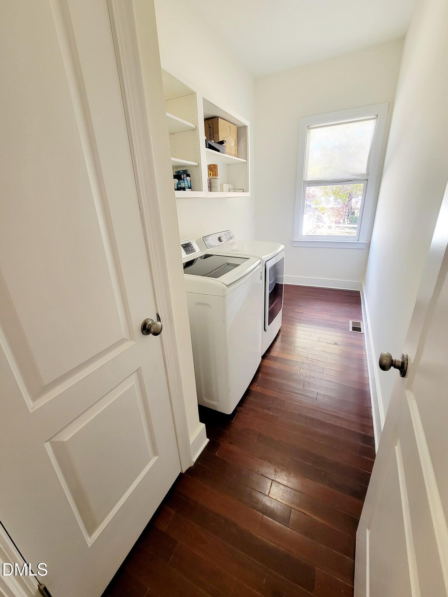 707 South East Street Raleigh, NC 27601 - Photo 36 of 46 a view of utility room with wooden floor and window