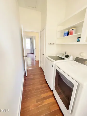 a view of a hallway with washer and dryer