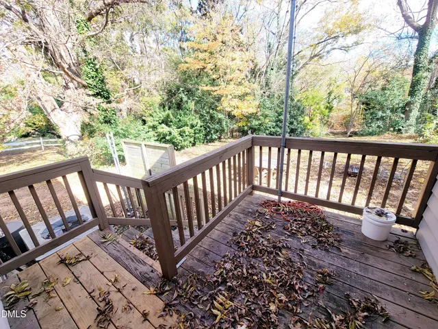 a view of a balcony with wooden floor