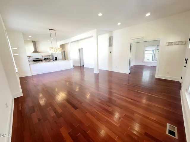 a view of kitchen with cabinets and wooden floor