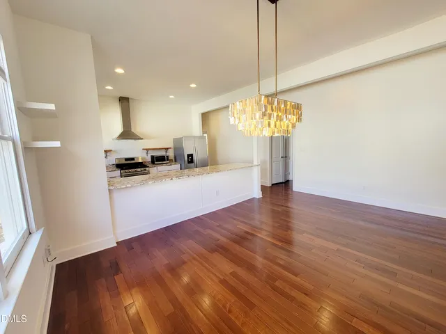 a view of a kitchen with microwave and cabinets