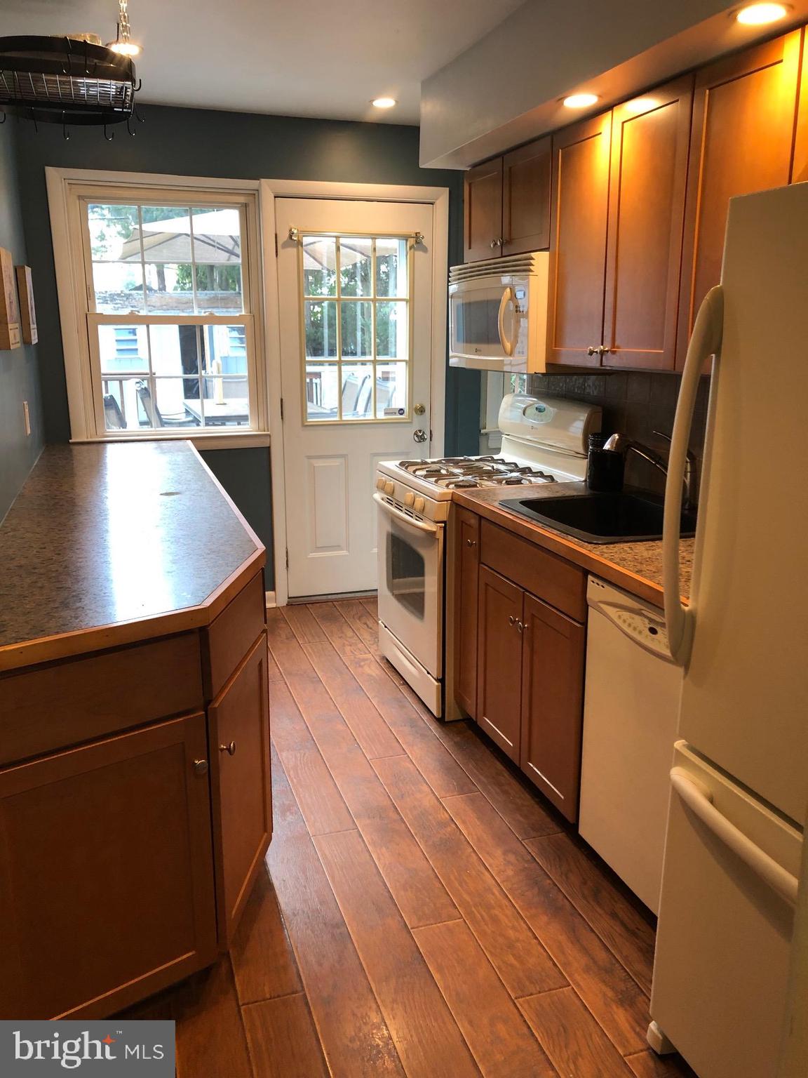 1411 Blackrock Road Swarthmore, PA 19081 - Photo 11 of 34 Kitchen exits to large deck, fenced yard & shed