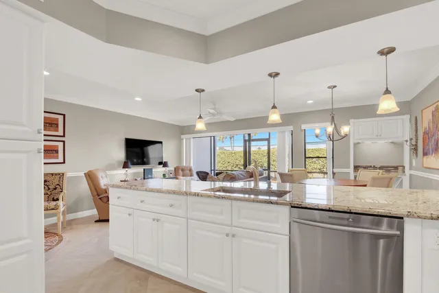 a kitchen with center island and windows