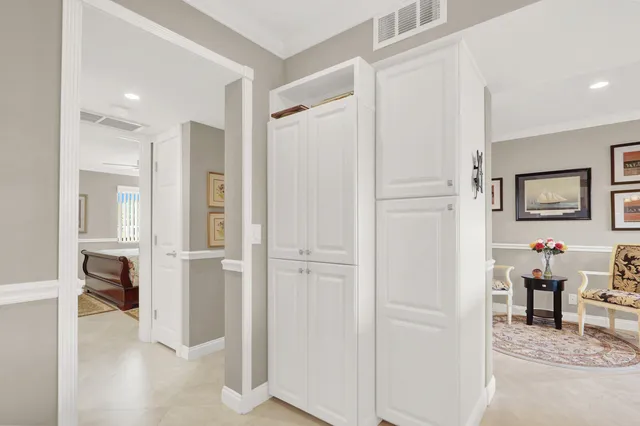 a view of a hallway with view of living room