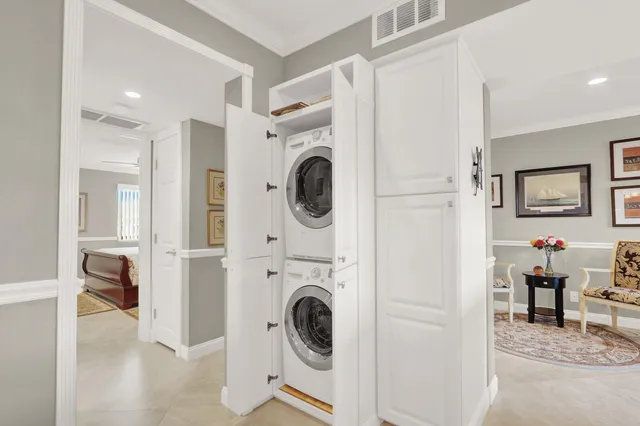 a view of a hallway with washer and dryer