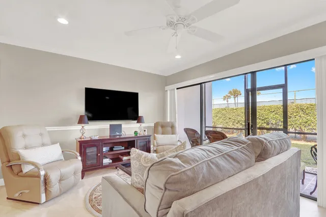 a large bedroom with a large bed and a flat screen tv