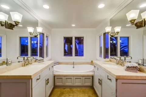 a bedroom with a bed and a table