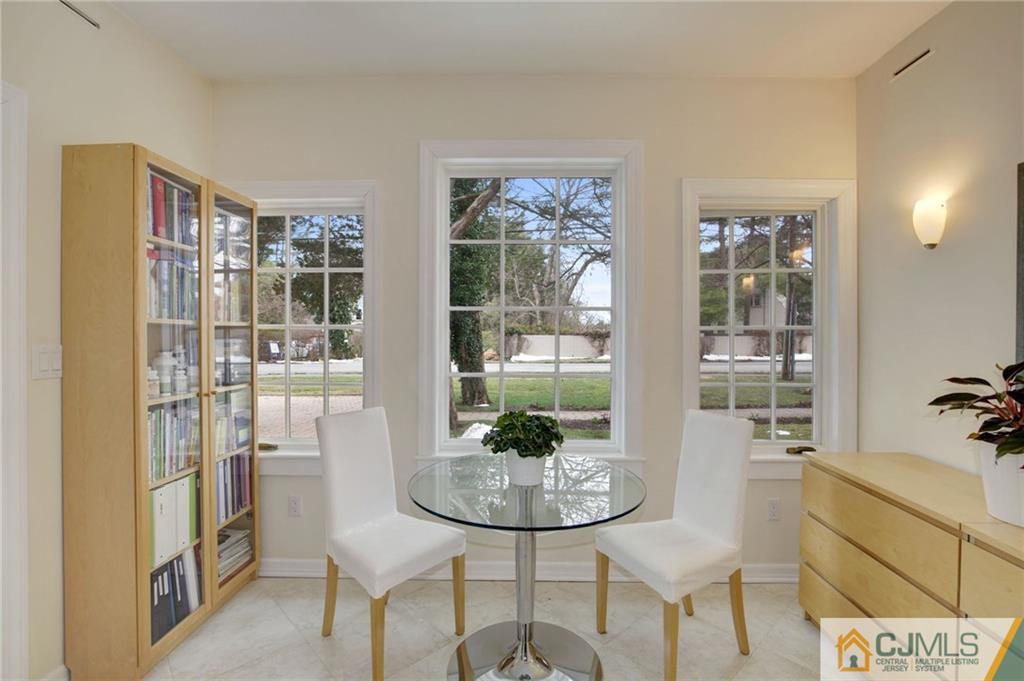 105 Elm Road Princeton, NJ 08540 - Photo 17 of 25 a view of a dining room with furniture wooden floor and a potted plant