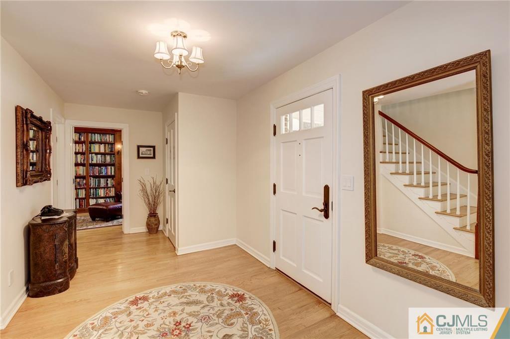 105 Elm Road Princeton, NJ 08540 - Photo 3 of 25 a view of a hallway with wooden floor and windows