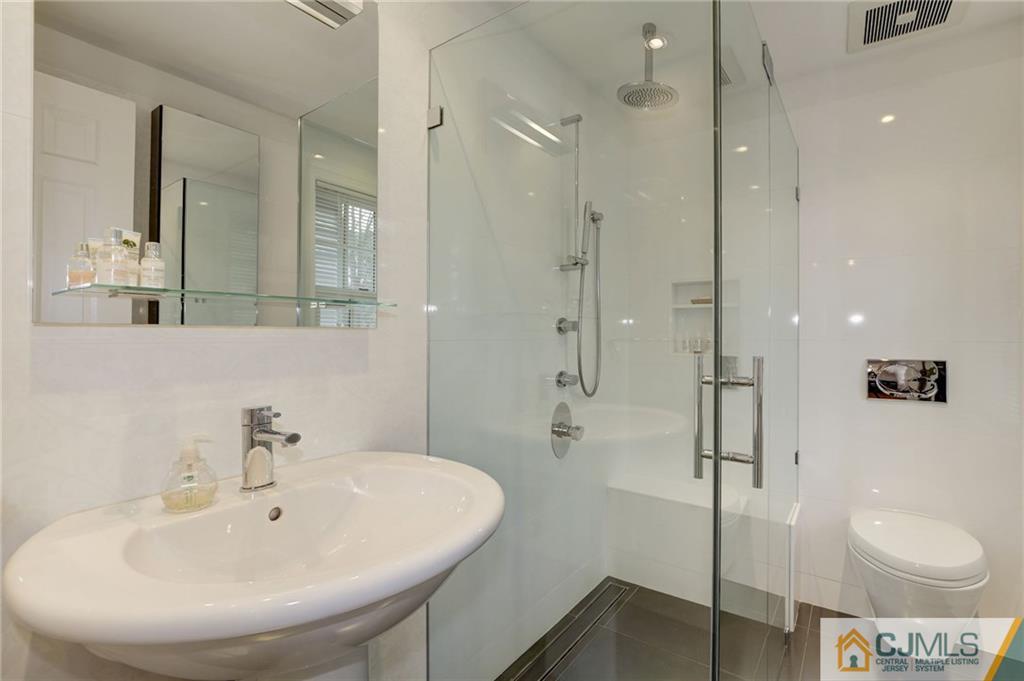 105 Elm Road Princeton, NJ 08540 - Photo 22 of 25 a bathroom with a sink a toilet and shower