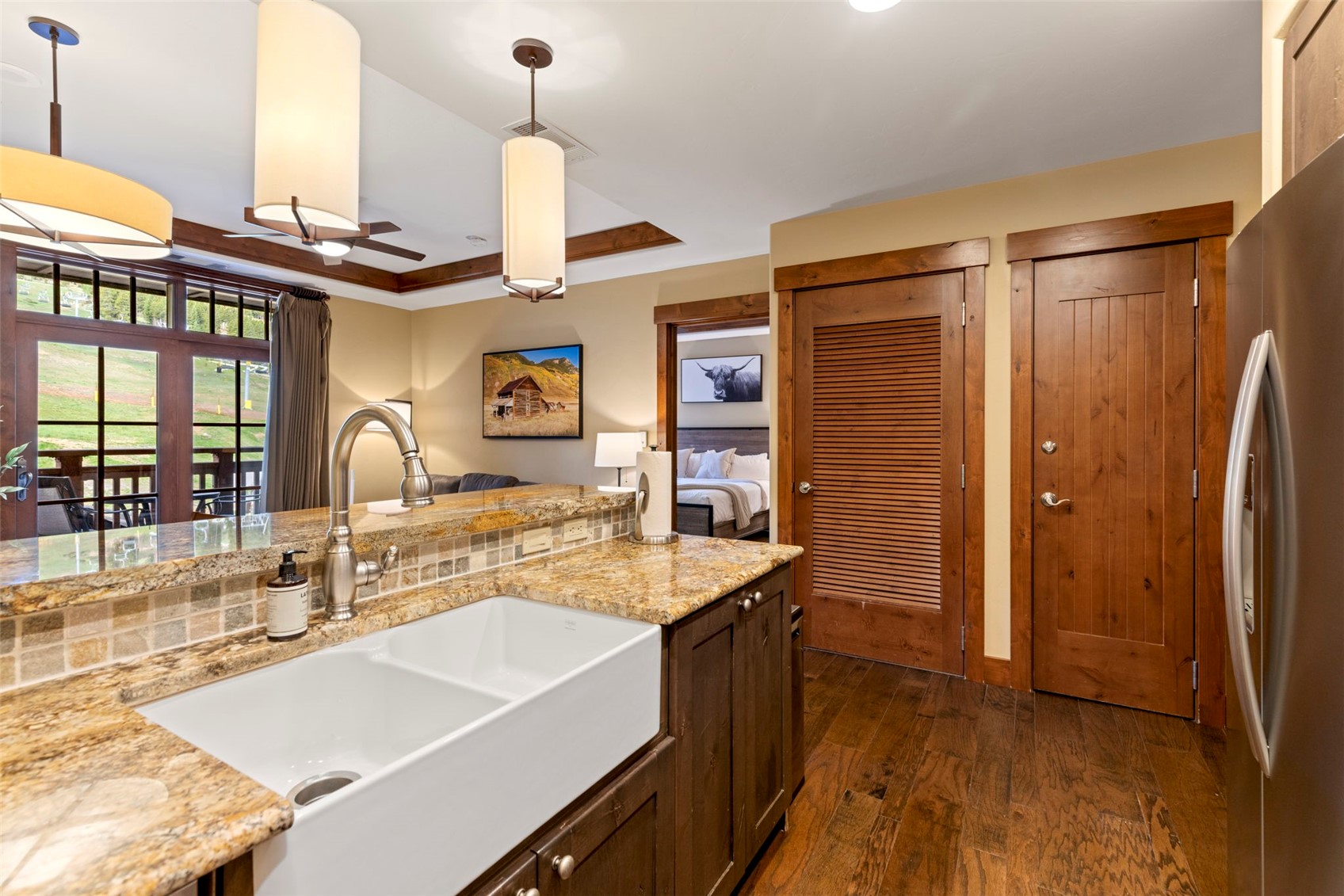 1521 Ski Hill Road, Unit 8313 Breckenridge, CO 80424 - Photo 15 of 45 a kitchen with stainless steel appliances granite countertop a sink and a refrigerator
