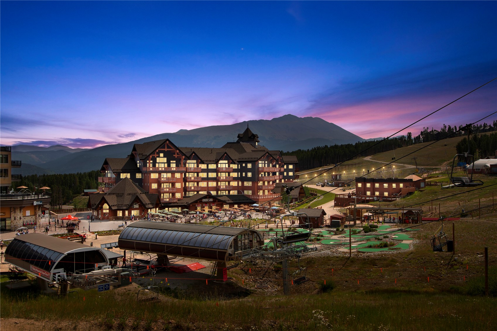 1521 Ski Hill Road, Unit 8313 Breckenridge, CO 80424 - Photo 29 of 45 a view of a patio with lawn chairs fire pit and water view