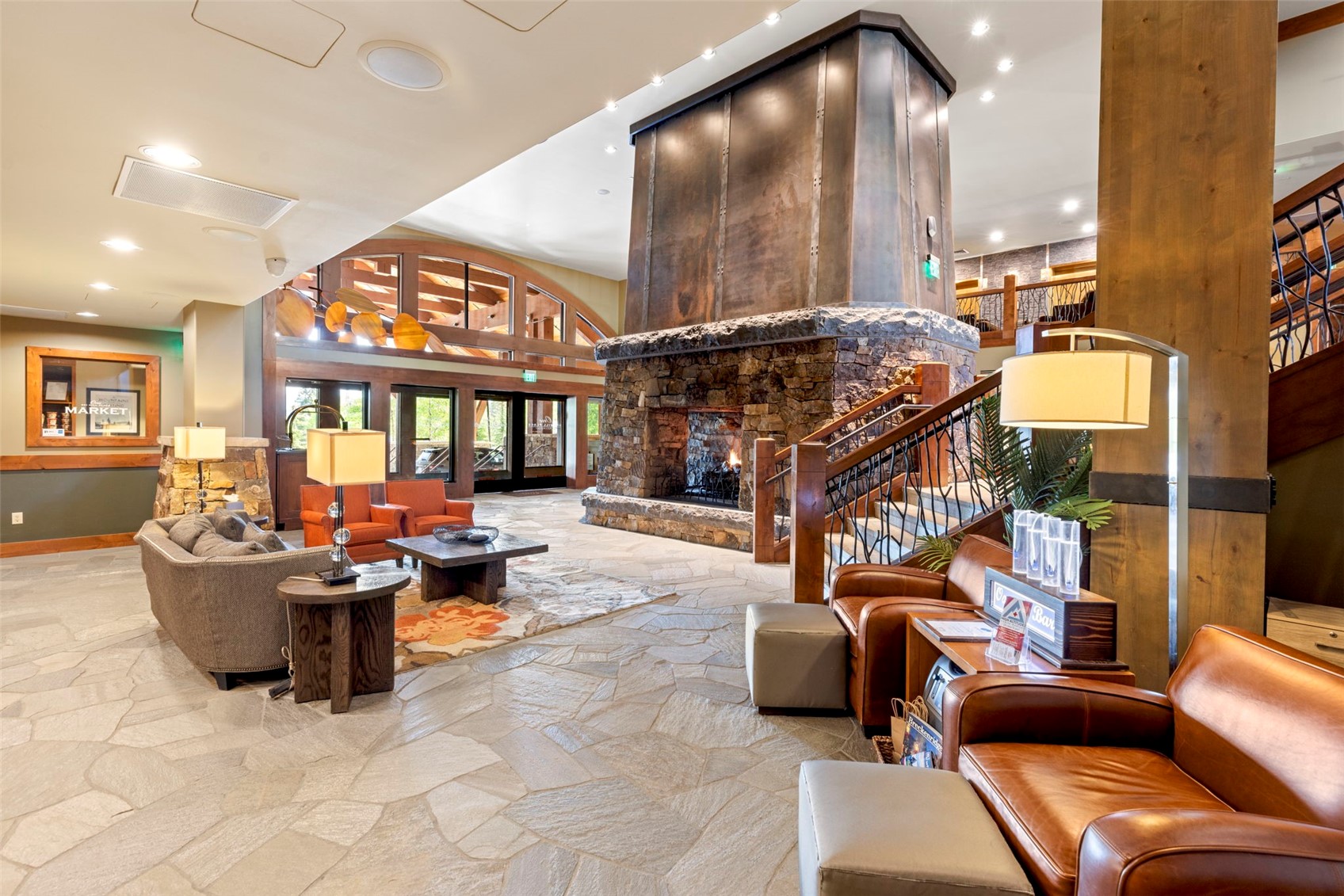 1521 Ski Hill Road, Unit 8313 Breckenridge, CO 80424 - Photo 30 of 45 a living room with furniture a chandelier and a large window