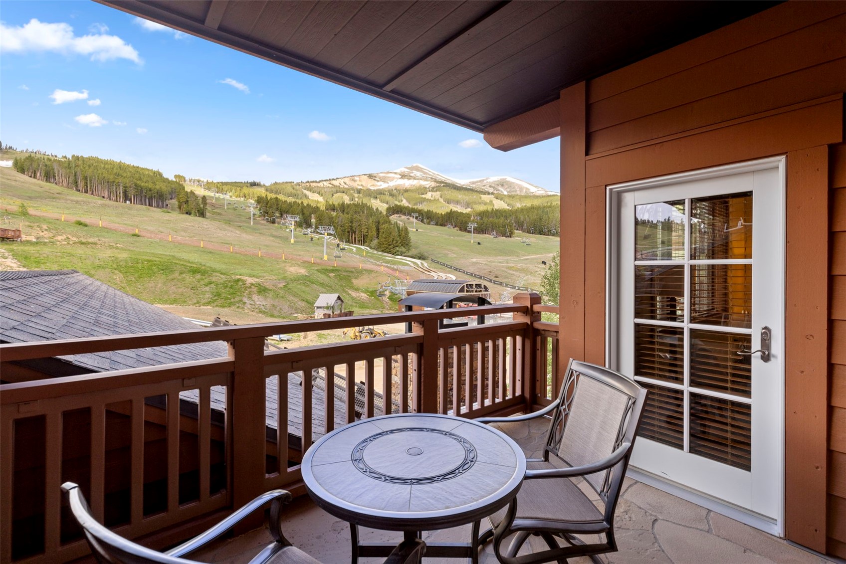 1521 Ski Hill Road, Unit 8313 Breckenridge, CO 80424 - Photo 3 of 45 a view of a chair and table in the balcony