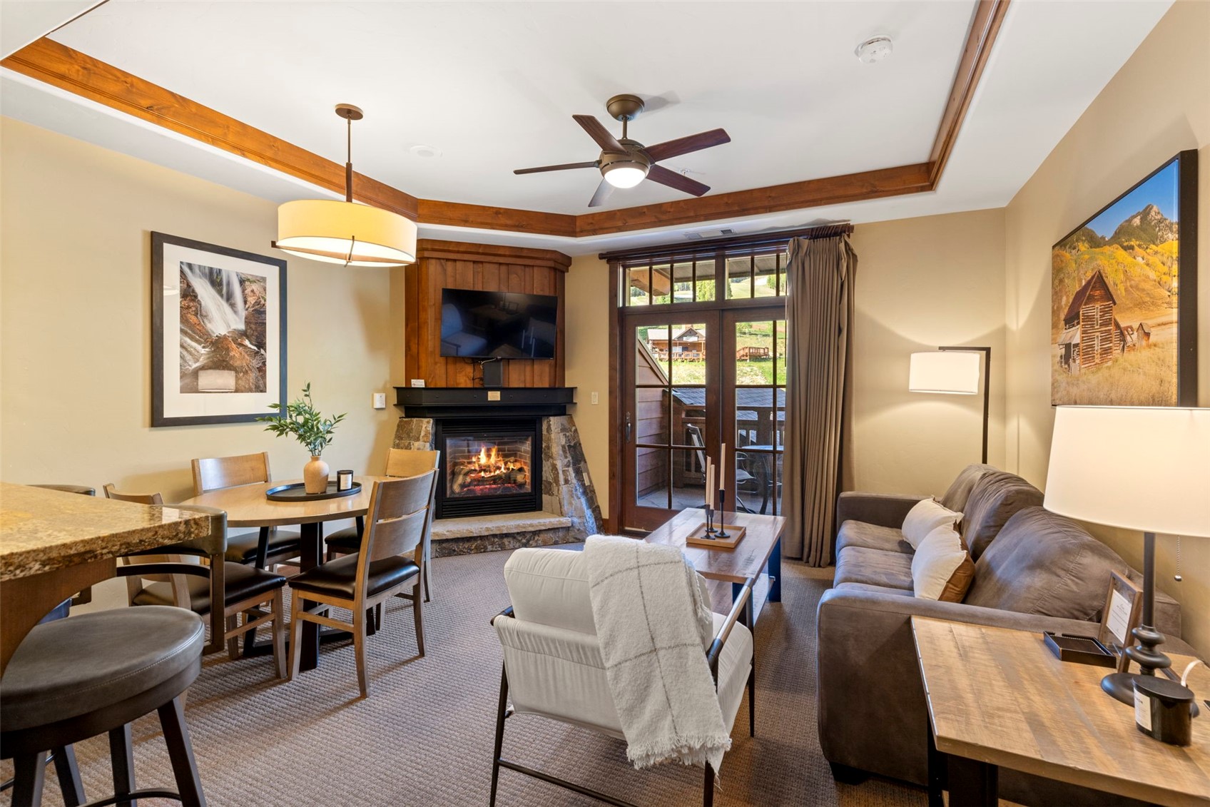 1521 Ski Hill Road, Unit 8313 Breckenridge, CO 80424 - Photo 4 of 45 a living room with fireplace furniture and a flat screen tv