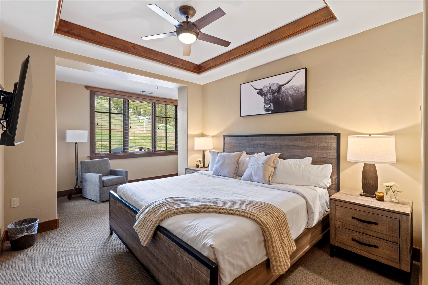 1521 Ski Hill Road, Unit 8313 Breckenridge, CO 80424 - Photo 5 of 45 a bedroom with a bed and a chandelier