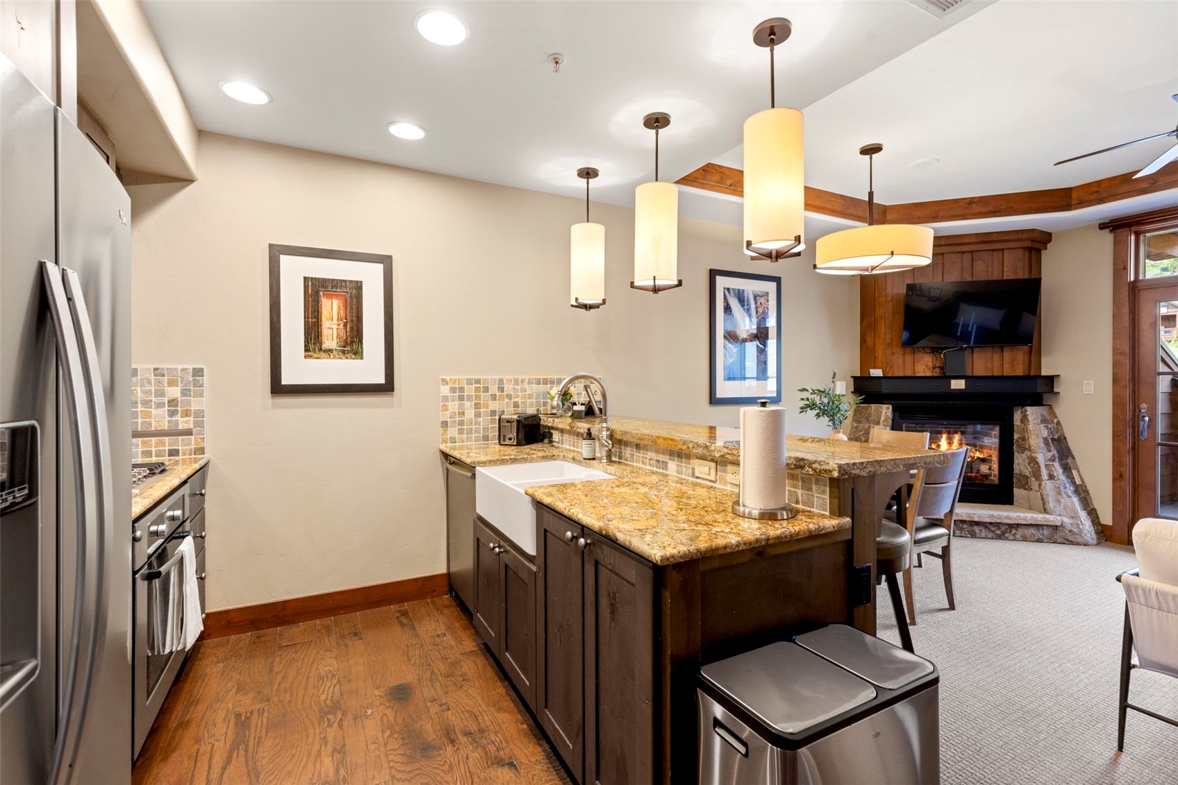 1521 Ski Hill Road, Unit 8313 Breckenridge, CO 80424 - Photo 6 of 45 a large kitchen with a table and chairs in it