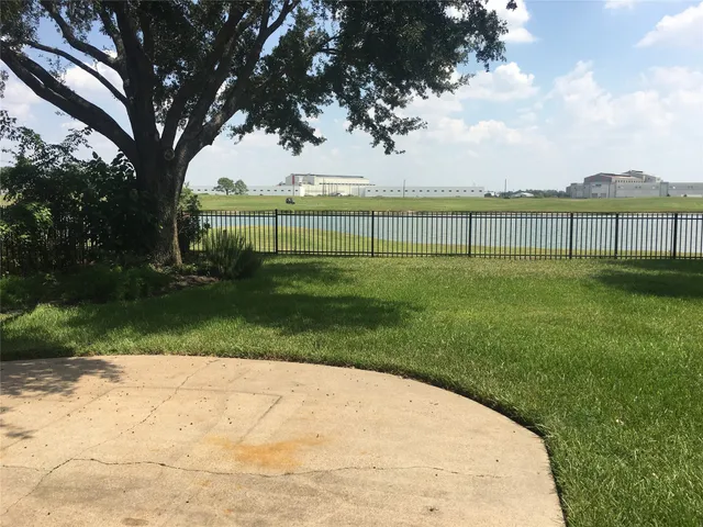 a spacious bathroom with a double vanity sink a mirror and a bathtub