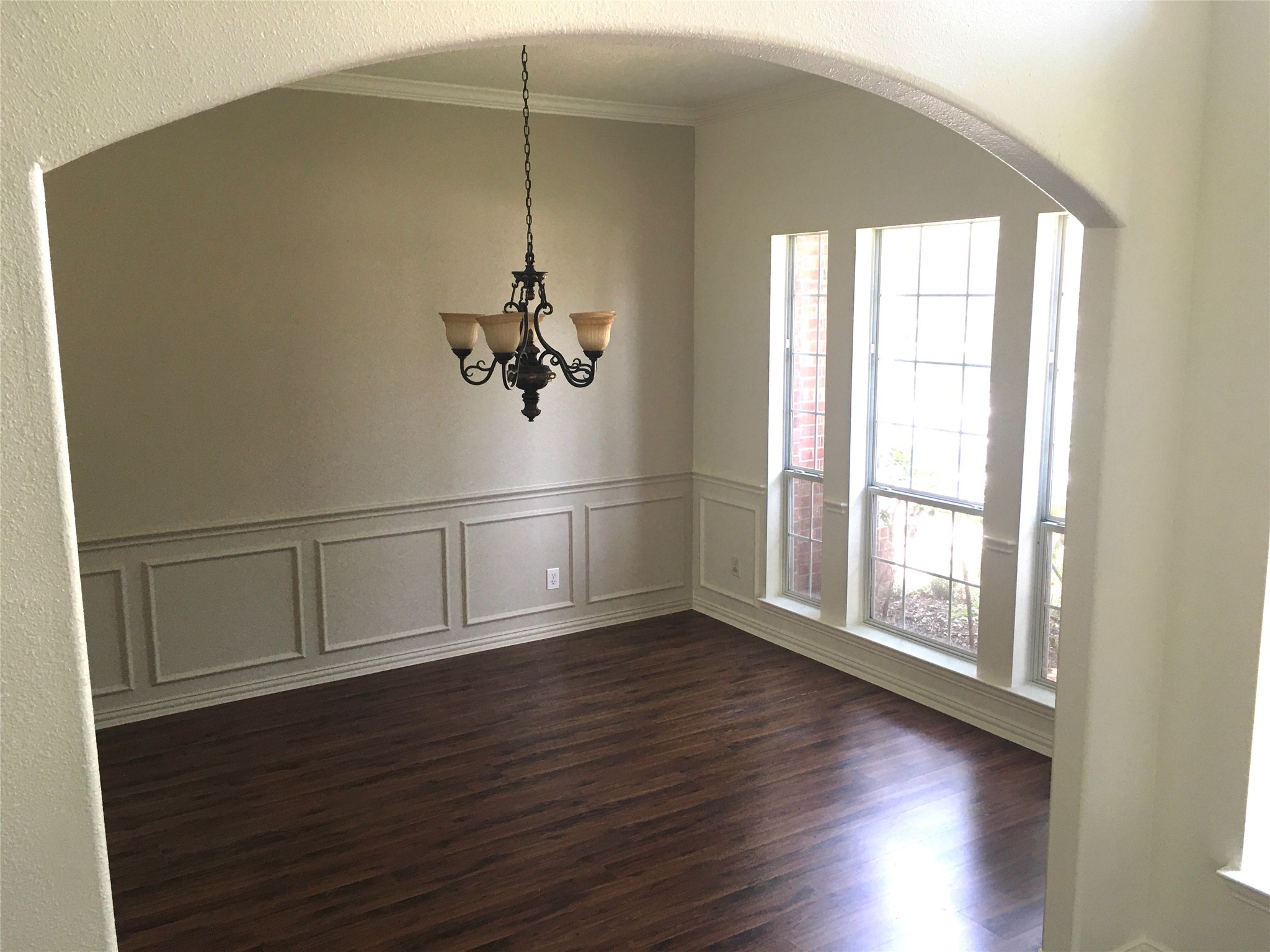 10730 Sea Myrtle Drive Houston, TX 77095 - Photo 13 of 36 a view of an empty room with wooden floor and a window