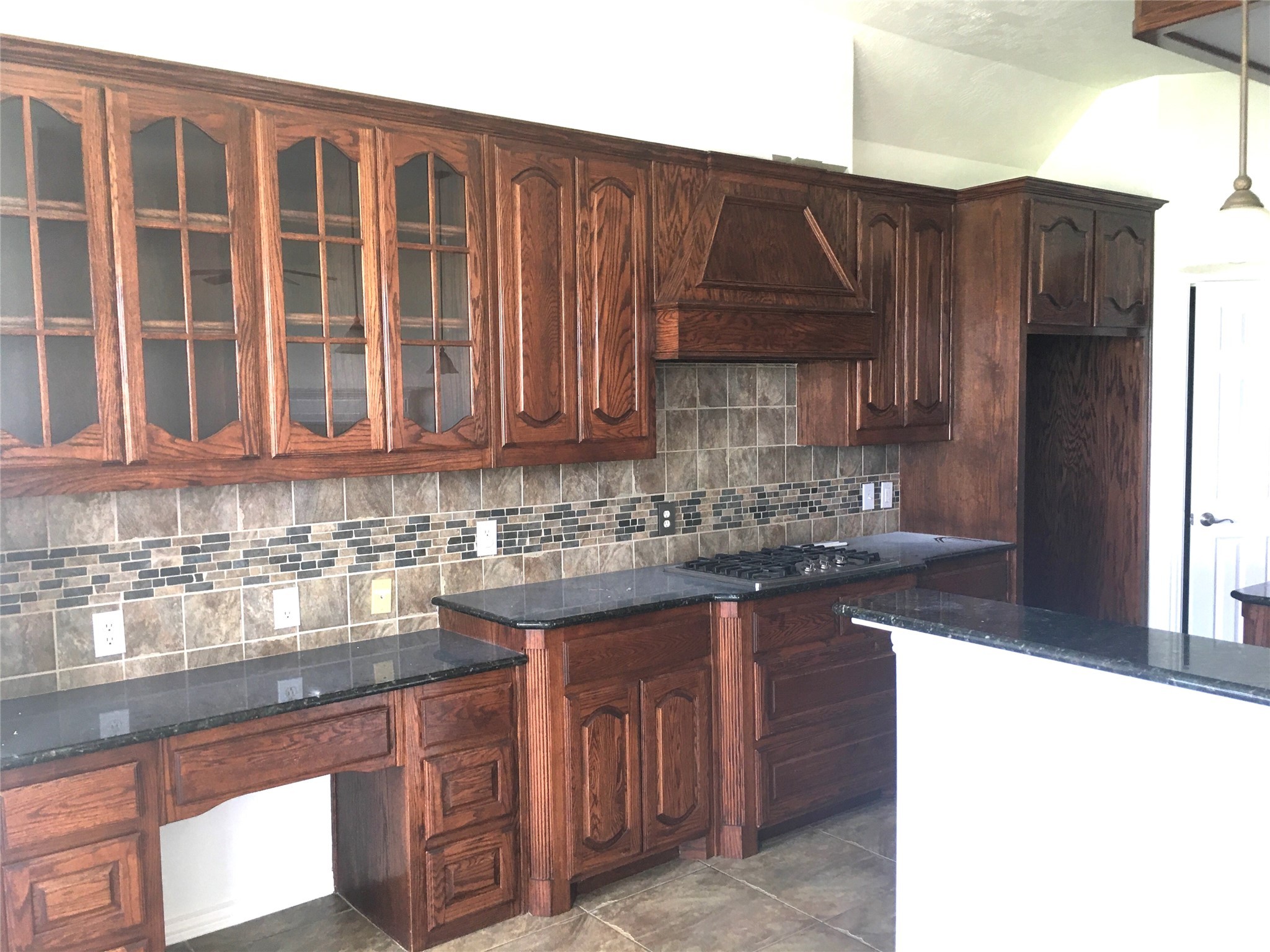 10730 Sea Myrtle Drive Houston, TX 77095 - Photo 19 of 36 a kitchen with stainless steel appliances granite countertop a sink and cabinets