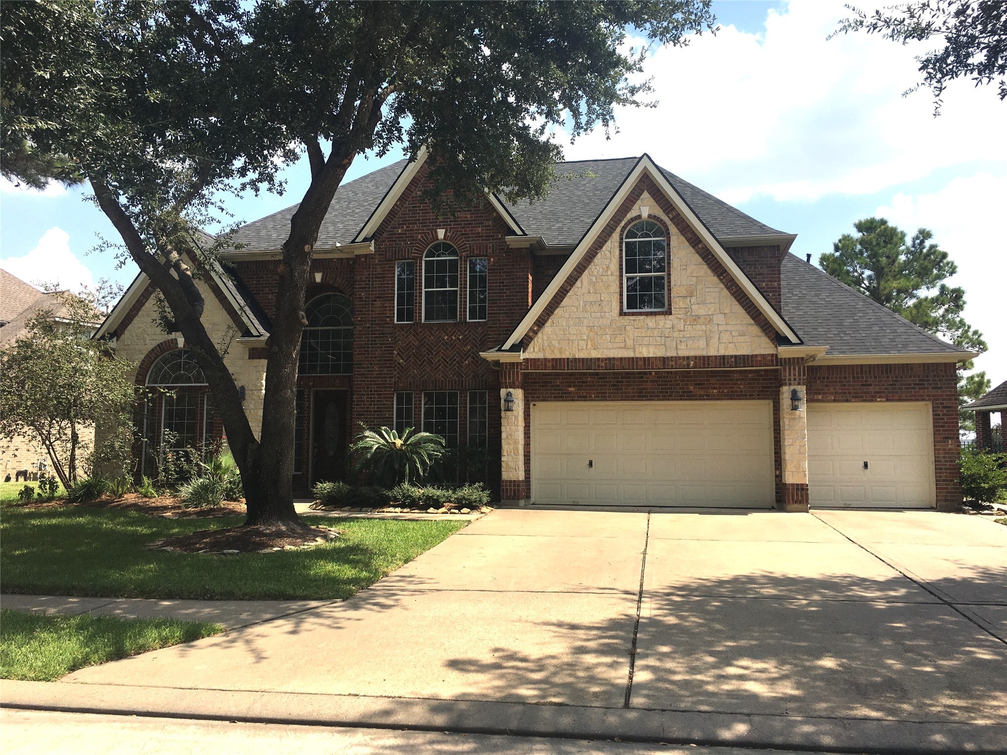 10730 Sea Myrtle Drive Houston, TX 77095 - Photo 3 of 36 a front view of a house with garden