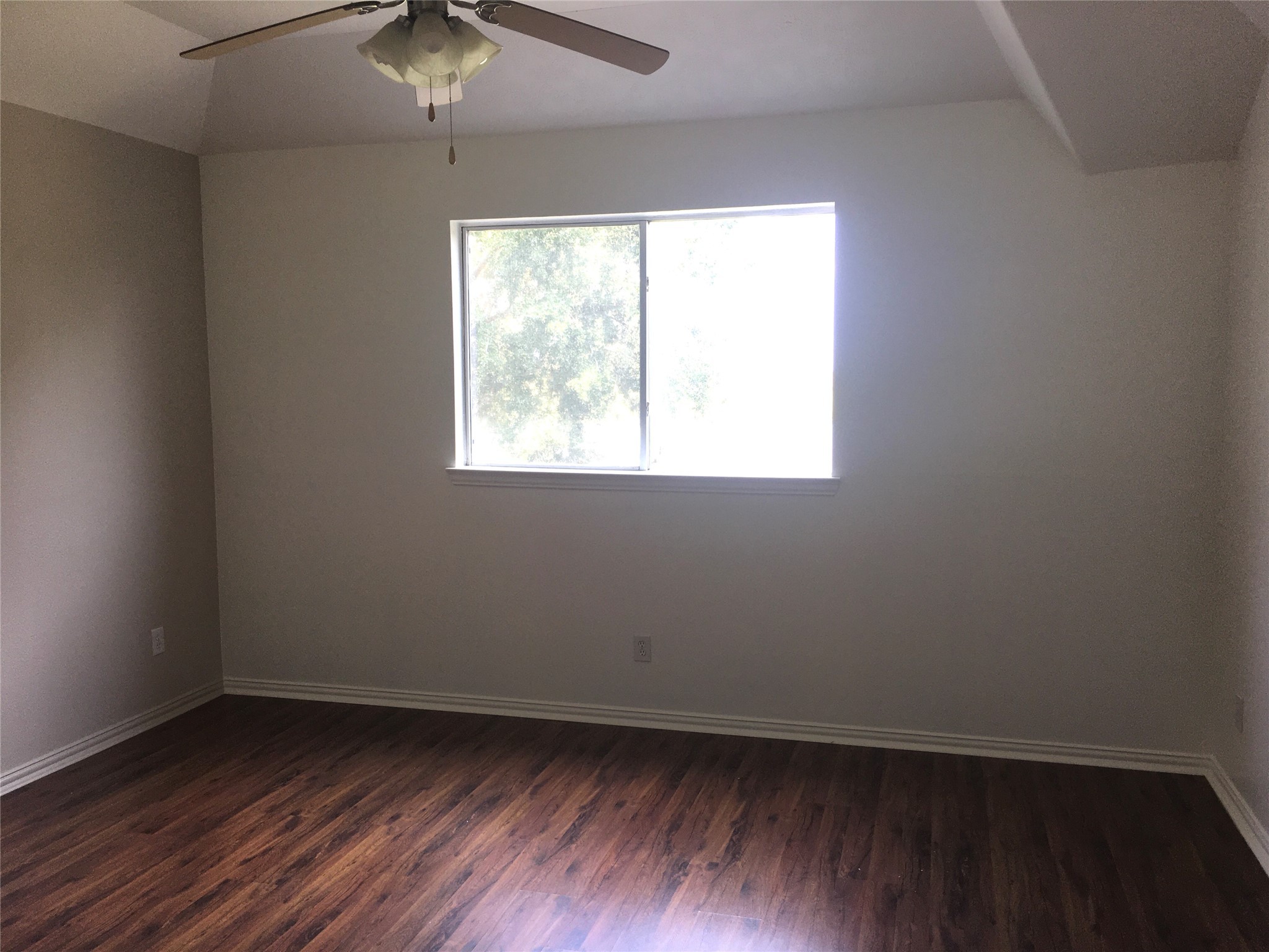 10730 Sea Myrtle Drive Houston, TX 77095 - Photo 32 of 36 an empty room with wooden floor and windows