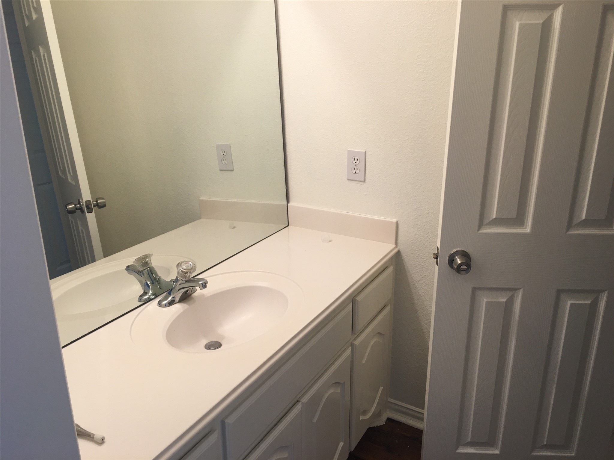 10730 Sea Myrtle Drive Houston, TX 77095 - Photo 34 of 36 a bathroom with a sink and a mirror