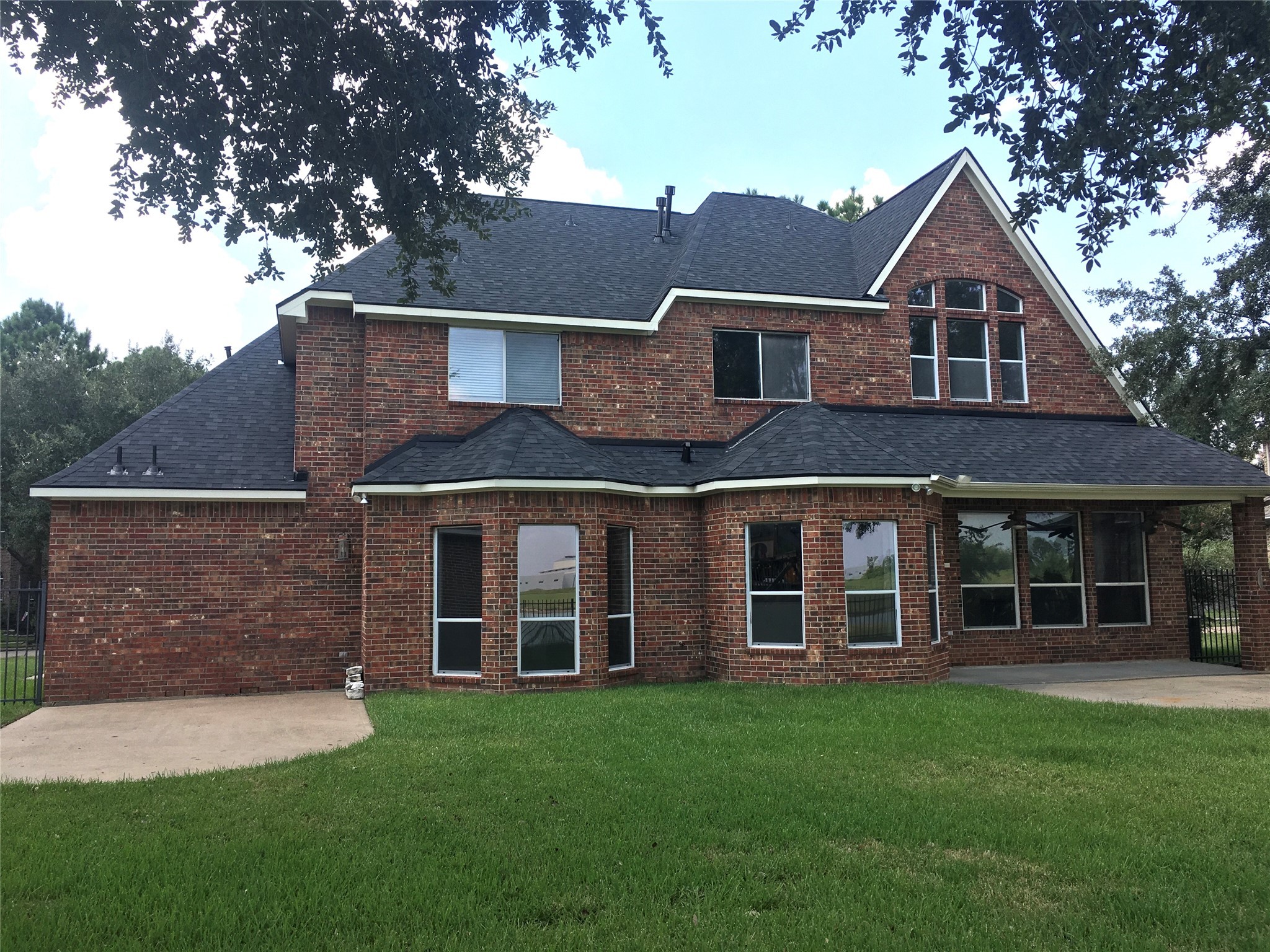 10730 Sea Myrtle Drive Houston, TX 77095 - Photo 4 of 36 front view of a house with a yard