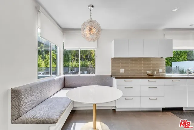a outdoor living space with patio furniture and garden view